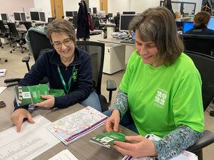 Games communications and events director Amanda Hibbs and volunteer Michelle Scott co-ordinate the leaflets which will be delivered to homes of people living on the routes of key Games events.