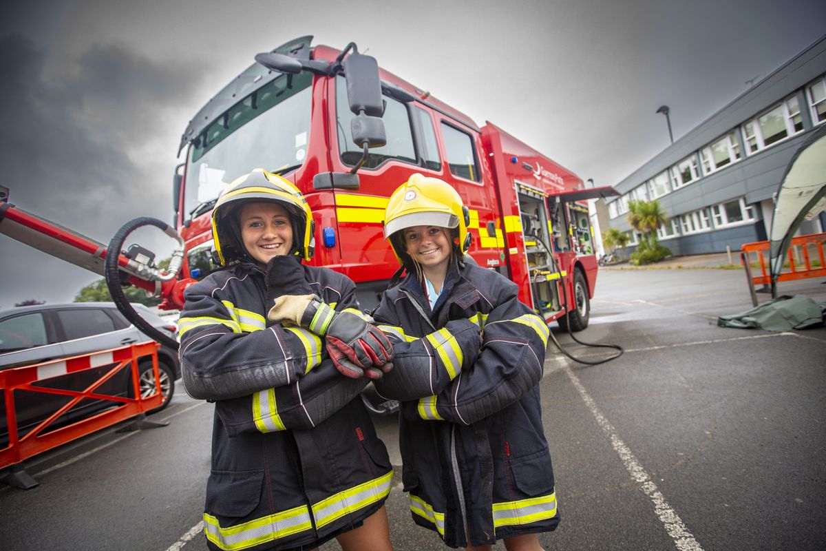 Girls in Years 9 and 10 learned all about different types of engineering courses as part of a Women in Engineering day at The Guernsey Institute. Getting hands-on experience with the airport fire appliance were Katie Smith, 14, left, and Aimee Lilley, 15. (Picture by Peter Frankland, 30980182)