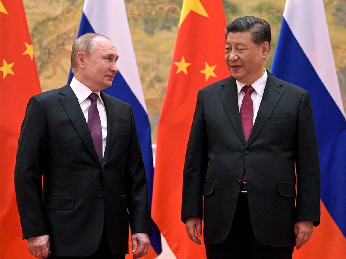 Chinese President Xi Jinping, right, and Russian President Vladimir Putin talk to each other during their meeting in Beijing on February 4 2022 (31115978)