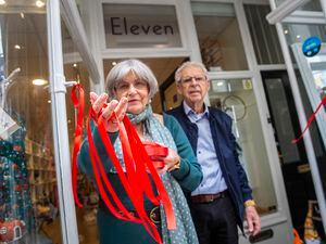 Picture by Luke Le Prevost. 20-09-23..Anna De Lisle is selling red ribbon at her shop Eleven in the lead up to the next States meeting where GST will be re-debated. L-R Anna De Lisle and Deputy David De Lisle. (32547811)