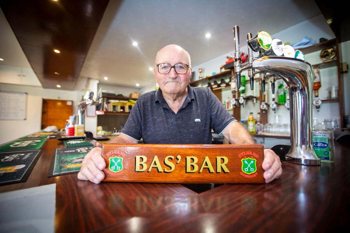 Bas Brehaut holds the sign that shows the bar in the Sylvans SC clubhouse has been named after him. (Picture by James Black, 30989571)