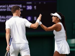 Joe Salisbury and Heather Watson during their mixed doubles match on day seven of the 2023 Wimbledon Championships at the All England Lawn Tennis and Croquet Club in Wimbledon. Picture date: Sunday July 9, 2023. PA Photo. See PA story TENNIS Wimbledon. Photo credit should read: John Walton/PA Wire. (32294339)