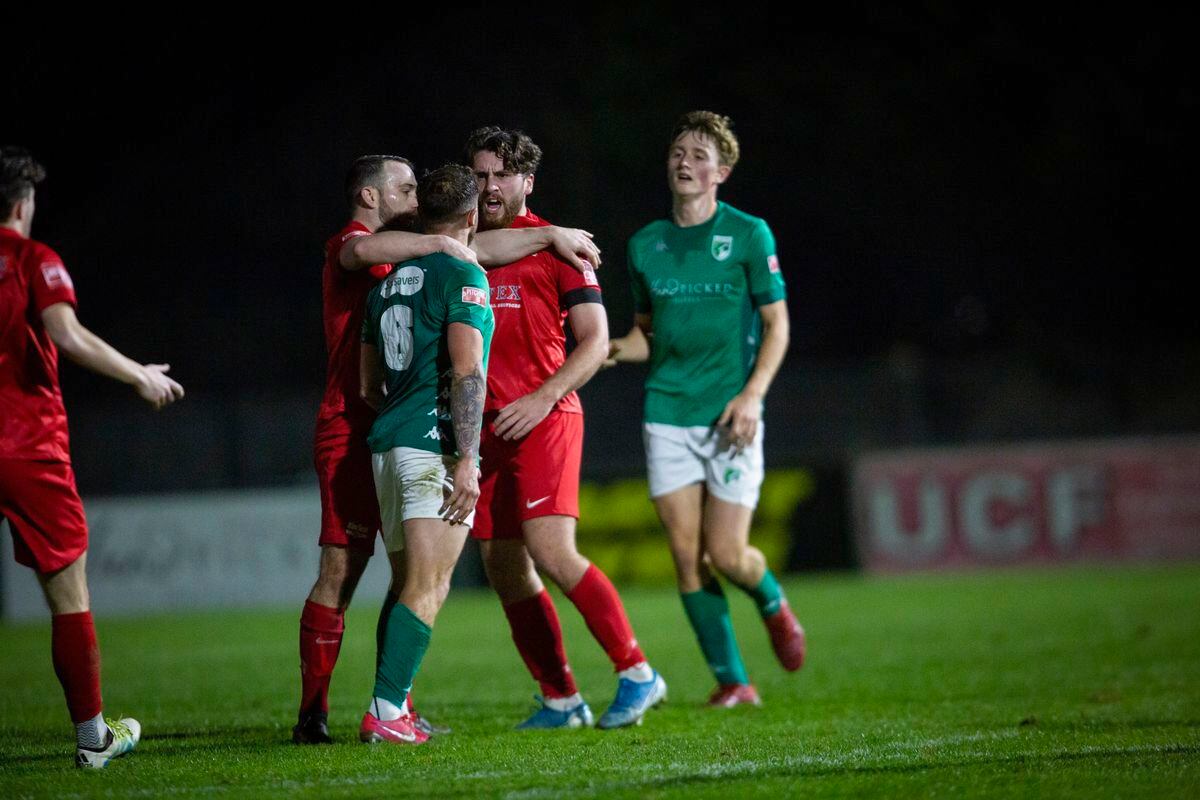 Guernsey FC No. 6 Kieran Mahon and a Binfield opponent are separated from one another last night at Footes Lane. (Picture by Sophie Rabey, 30433426)