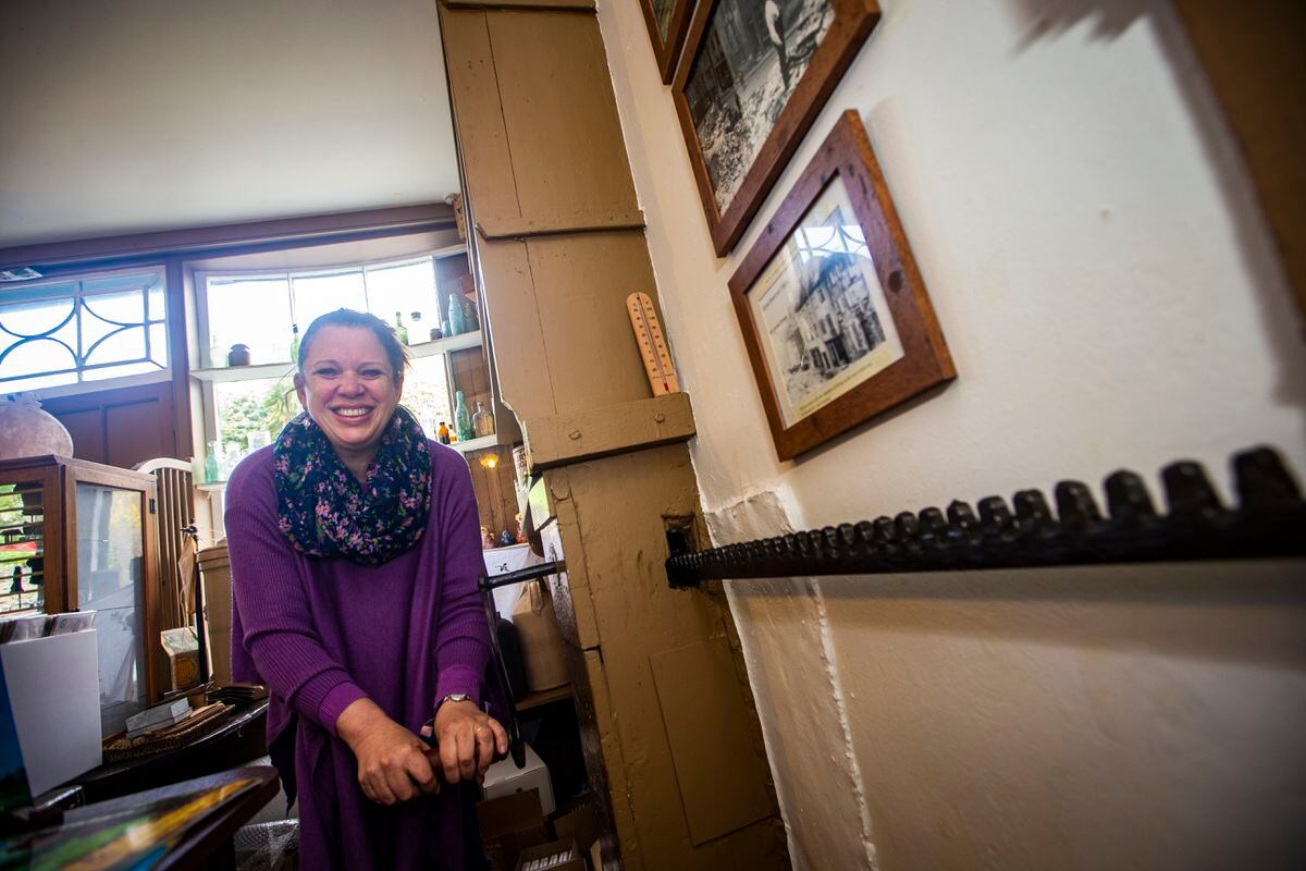 Shop manager Caro Drake winding the barrel shutters at The National Trust Victorian Shop in Cornet Street which is opening for the summer season. (Picture by Peter Frankland, 31947692)
