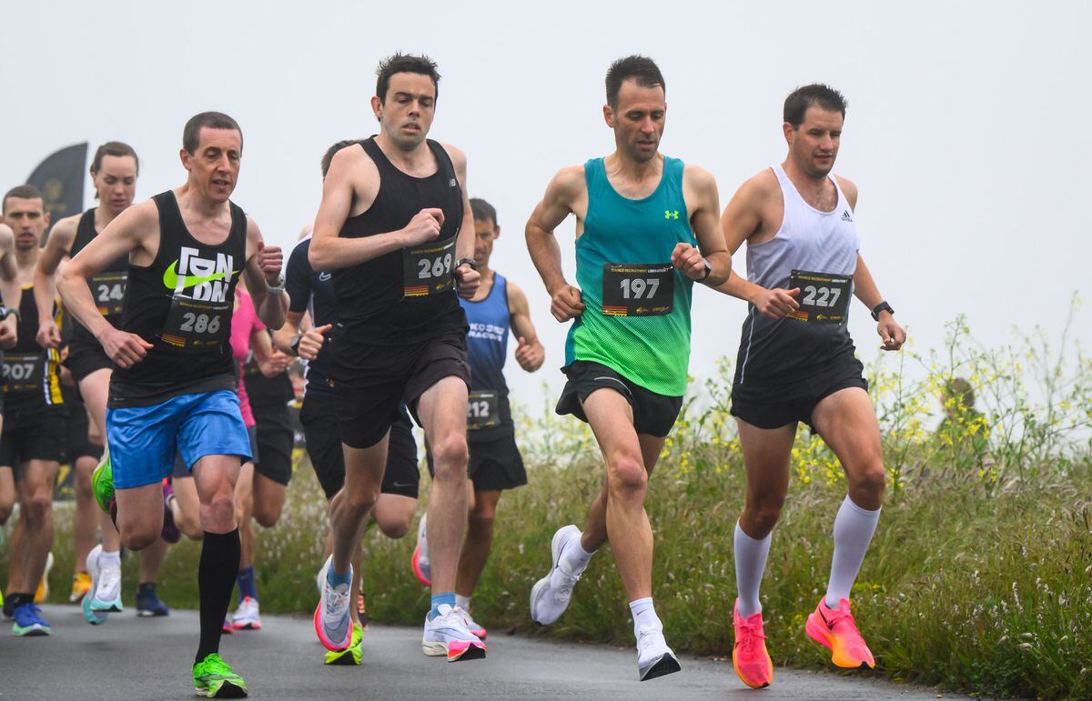 Pic supplied by Andrew Le Poidevin: 09-05-2023...Guernsey Athletics 2023 Liberation Day 7 mile road run. Runners leave the starting area at Rousse in the foggy conditions. L-R Pete Amy, James Priest, Steve Dawes and Rick Weston. (32093665)