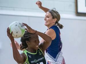 Resolution IT Green's Verona Tomlin in possession of the ball while under pressure from Specsavers Lightening B's Sammie Cox as the new top-flight season got under way on Tuesday. (Picture by Peter Frankland, 30012109)