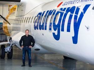 Aurigny CEO Nico Bezuidenhout alongside one of its three ATR aircraft. One way it saved money was flying full ATRs rather than the Embraer jet with half the seats empty. (Picture by Peter Frankland, 31061012)