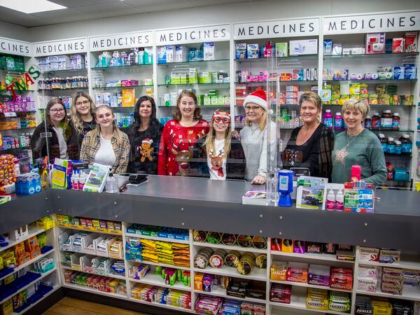 Working on with a smile and a festive jumper... Staff at local pharmacies, including the team at Stonelakes on the Bridge, are sometimes having to tell customers to wait days for prescriptions as global shortages have a local impact. (Picture by Sophie Rabey, 31551646)
