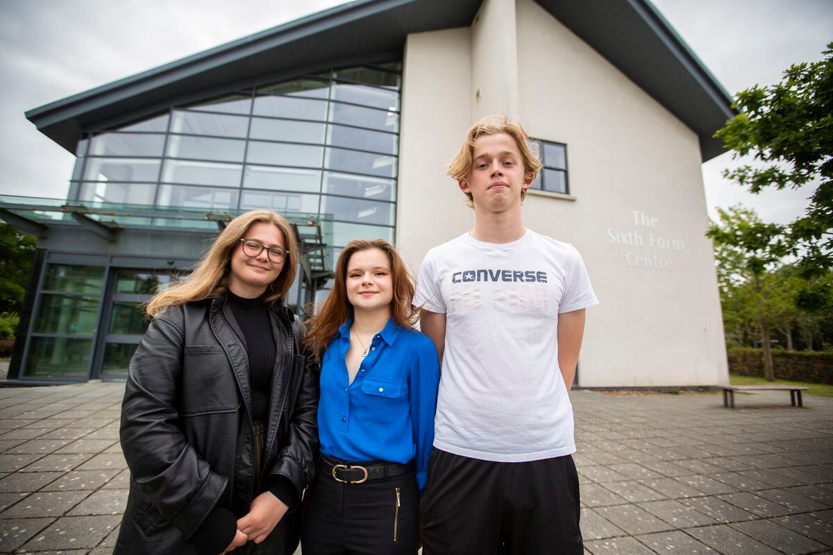 Rhianna Trump, 17, centre, was the first Guernsey student to score a 45 out of 45 in the International Baccalaureate. She is pictured with two other successful students, Jess Rowe and Sam Lowe, both 18. (Picture by Luke Le Prevost, 31011794)