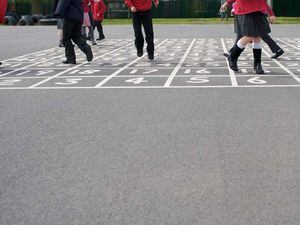 British primary school children playing in the playground (32474372)