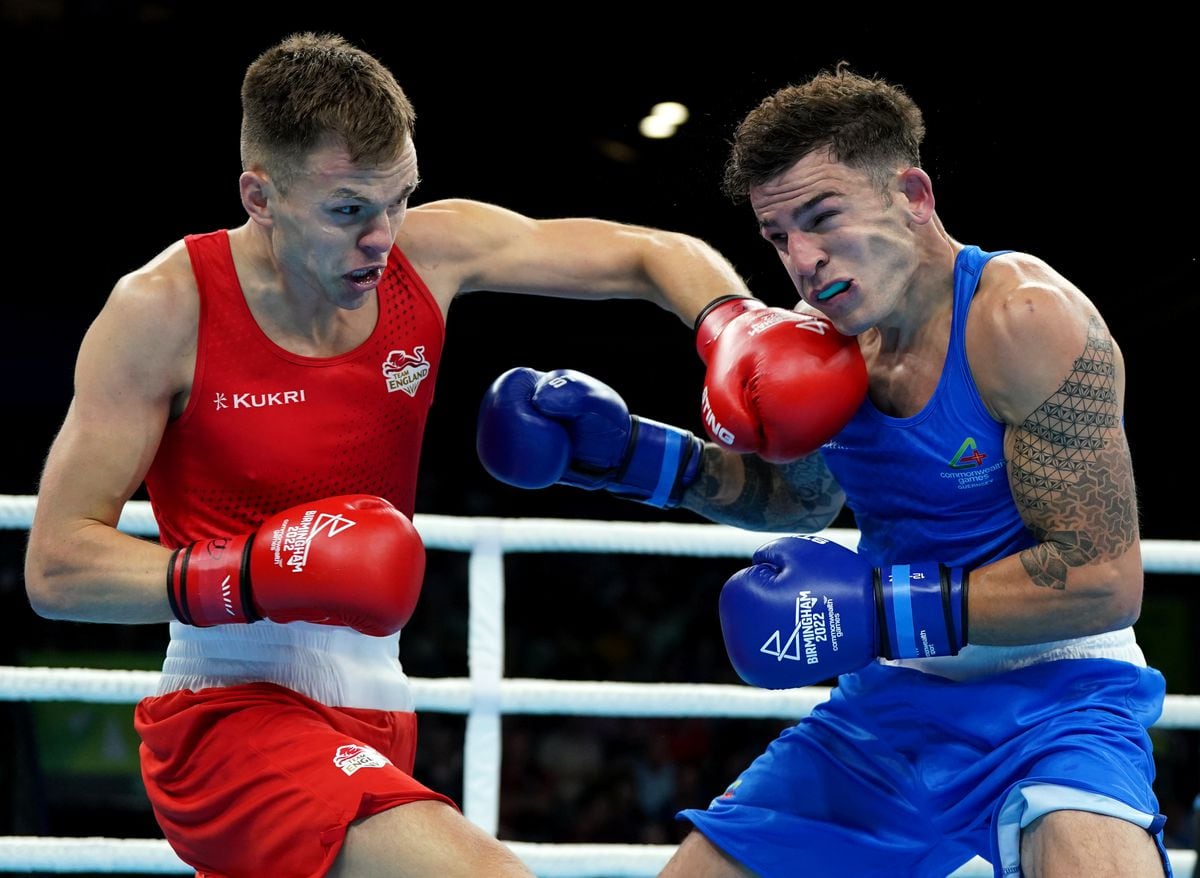 England's Lewis Richardson (left) lands a left on the chin of Billy Le Poullain during their middleweight quarter-final at the NEC. (Picture by PA, 31109879)