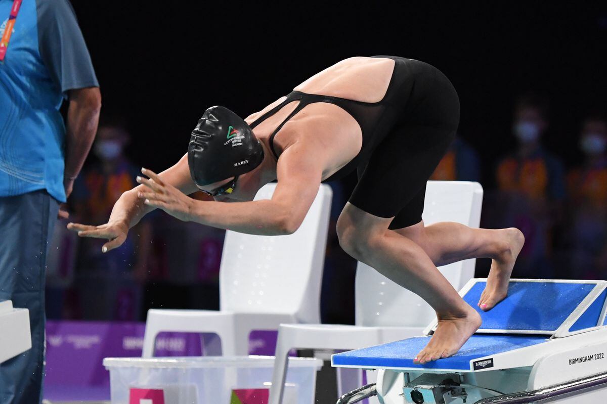 Orla Rabey dives into the water yesterday at the Sandwell Aquatics Centre where she broke the Island women's 100m long-course freestyle record. (Picture by David Ferguson, 31096689)