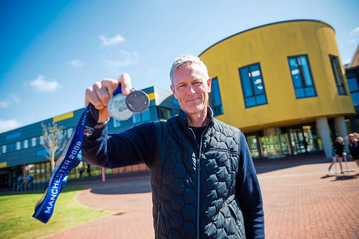 Olympic swimmer and former world record holder Mark Foster took some of his many medals when he gave a talk at St Sampson's High School. (Pictures by Peter Frankland, 24569600)