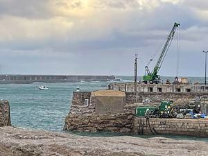 Alderney's new harbour crane was finally moved out of reach of corrosive sea spray on the quay after a push from island politicians to protect the island's asset. (Picture supplied by Alderney States member Steve Roberts.)