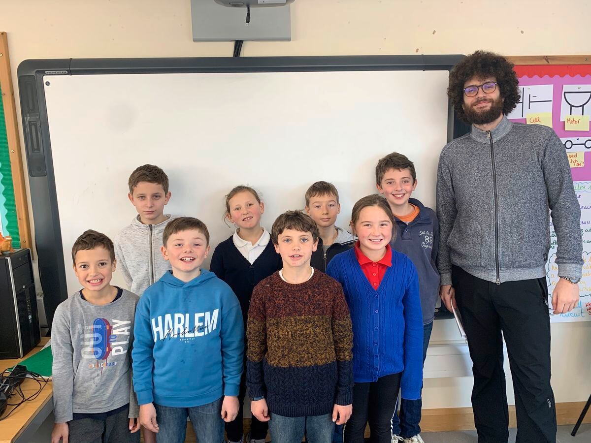 Students from Sark School's class 3 with Czech PhD student Martin Neudorfl (Picture supplied by Sark School)
