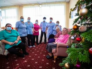 Summerland House Care Home staff who are working over the Christmas period. Left to right: Elsa Pereia, Betty Abreu, Elsa Dunne, Sarah Ross, Husain Ahmed, Matilda De Jesus and Lyndsey Nicholls with residents Margaret Norledge and Mona Falla. (Picture by Peter Frankland, 30322901)