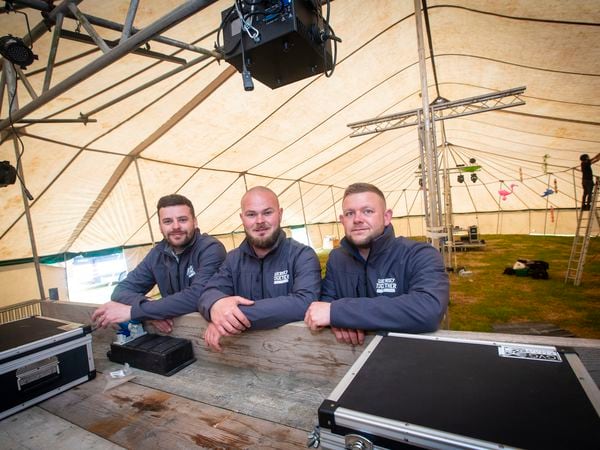 Picture By Peter Frankland. 26-05-22 Guernsey Together Festival 2022 is being set up at The Rabbit Warren. L-R - John Woodhead, Tom Oakman and Alex Lock.. (30866827)
