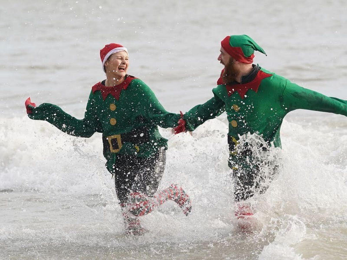 In Pictures: Swimmers take a dip and shoppers eye sales on Boxing Day ...