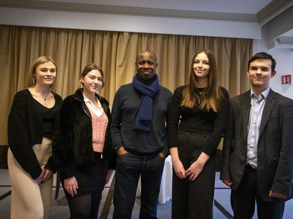 Picture by Luke Le Prevost. 09-03-23..Clive Myrie visted Guernsey to give a talk to sixth form media students from Elizabeth College and Grammar School about the profession at St Pierre Park Hotel. Clive with students from Grammar School L-R Gracie King (18), Charis Collins (18), Maisy Batiste (17) and Daniel Gordon (17). (31884092)