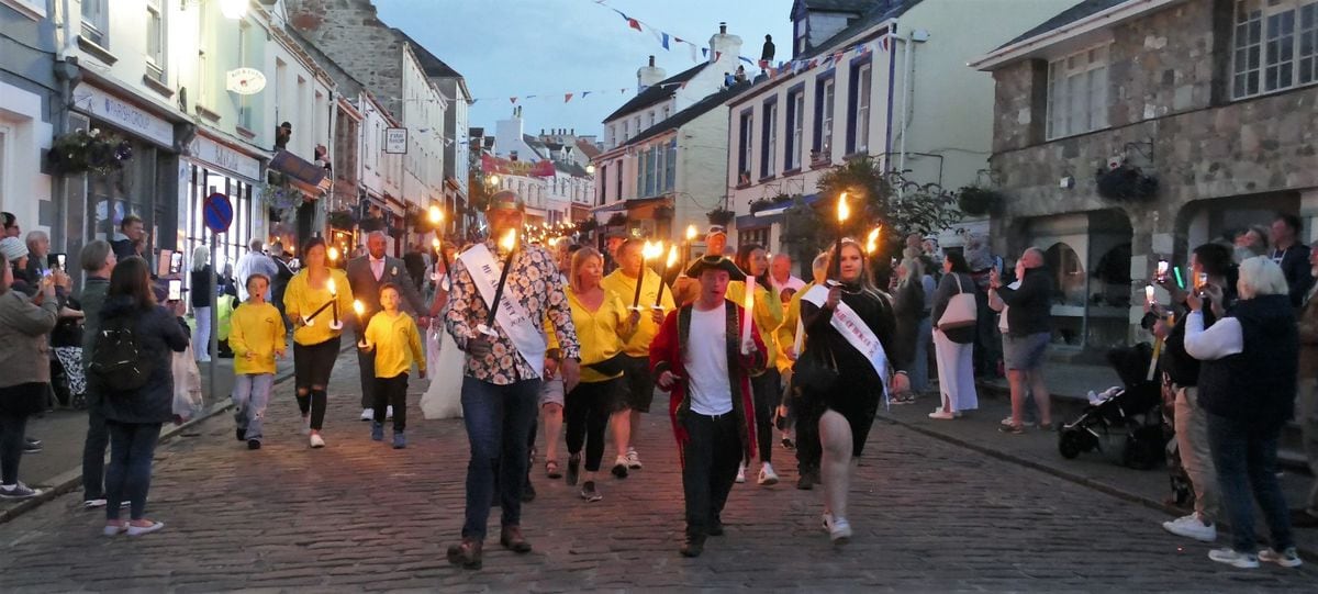 The traditional torchlight procession, follwed by a spectacular bonfire and firework display, brought Alderney Week 2023 to a close over the weekend. (Pictures by David Nash, 32422761)