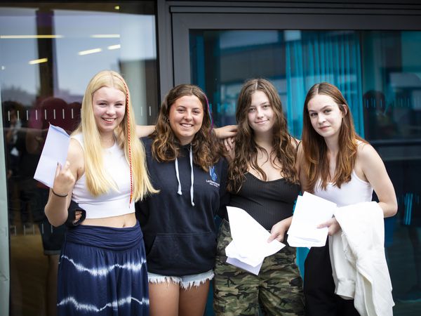 Picture By Peter Frankland. 24-08-23 GCSE results. Les Beaucamps School. L-R - 16 year olds Georgina Batiste, Leah Torode, Amelia Duff and Olivia Kettlety.. (32457783)