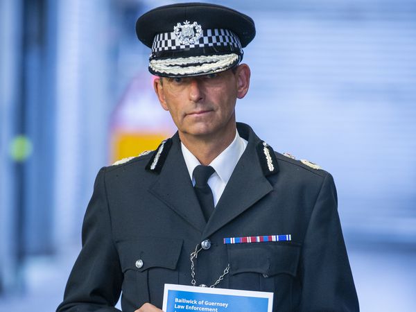 Ruari Hardy, head of Bailiwick Law Enforcement, holding a copy of his annual report for 2021. (Picture by Peter Frankland, 31318765)