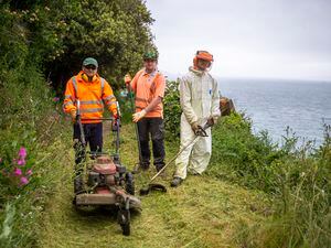 Picture by Luke Le Prevost. 01-06-23..Pathways around Bec du Nez / Marble Bay are being strimmed and cleared by States Work in preperation for the Saffery Rotary Walk. L-R Groundsmen Russ Sarre, Matthew Smith and Josh Baudains. (32172262)