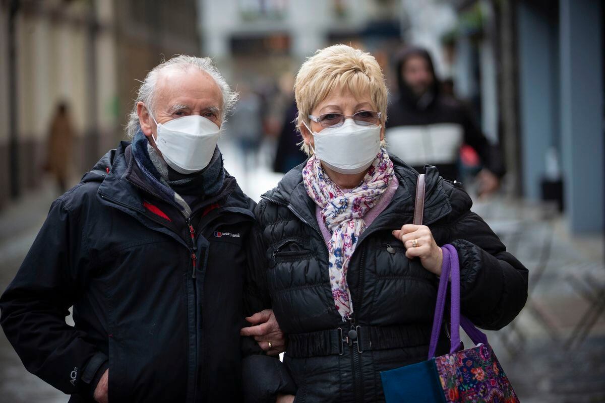 Peter and Margaret Holland in Town yesterday, the first day of mandatory mask-wearing in shops. (Picture by Peter Frankland, 30262242)