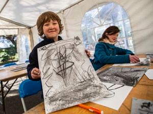 Picture by Sophie Rabey.  19-03-23.  Guernsey Museums and Guernsey Arts hosted a Wild Escape event at Candie Museum..Guernsey Arts workshop for people to use charcol to draw their own stormy scenes..Heron Colmer (aged 6) with one of his many creations.. (31921782)