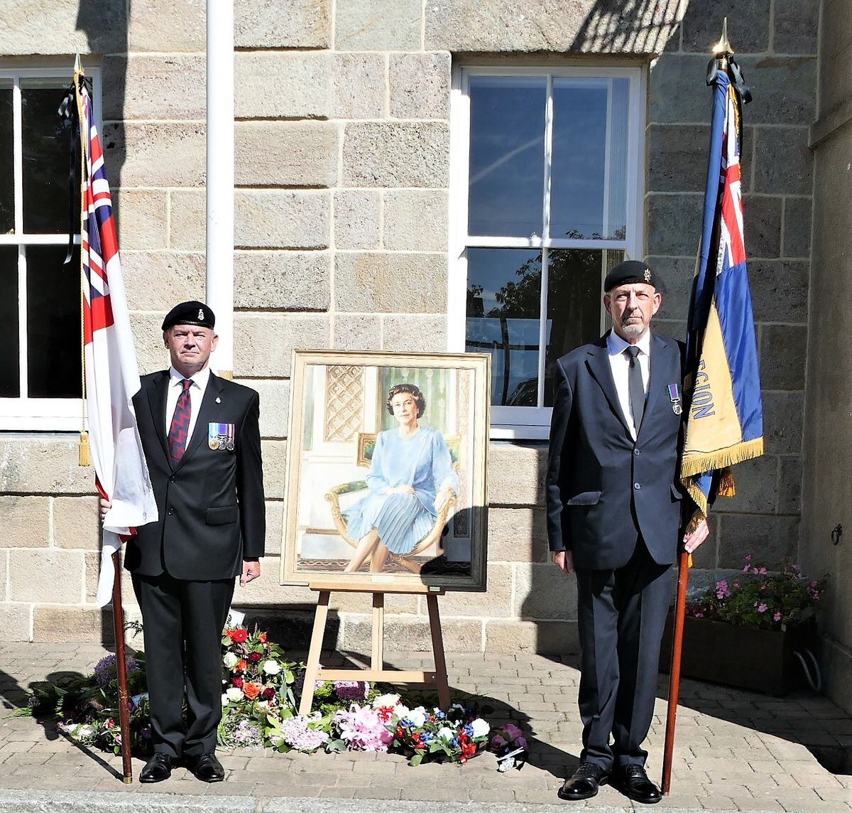 Islanders’ floral tributes surround a portrait of the Queen.    Picture by David Nash.                                                                                             (31257686)