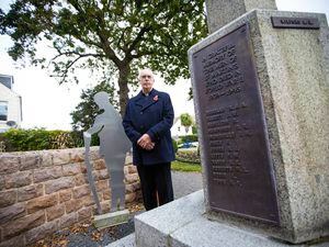 Picture By Peter Frankland. 08-11-21 The Very Reverend John Guille at the St. Martin's war memorial where 12 names have been added of men from the parish who lost their lives in WWII..The plaque will be unveilled on Thursday.. (30173351)