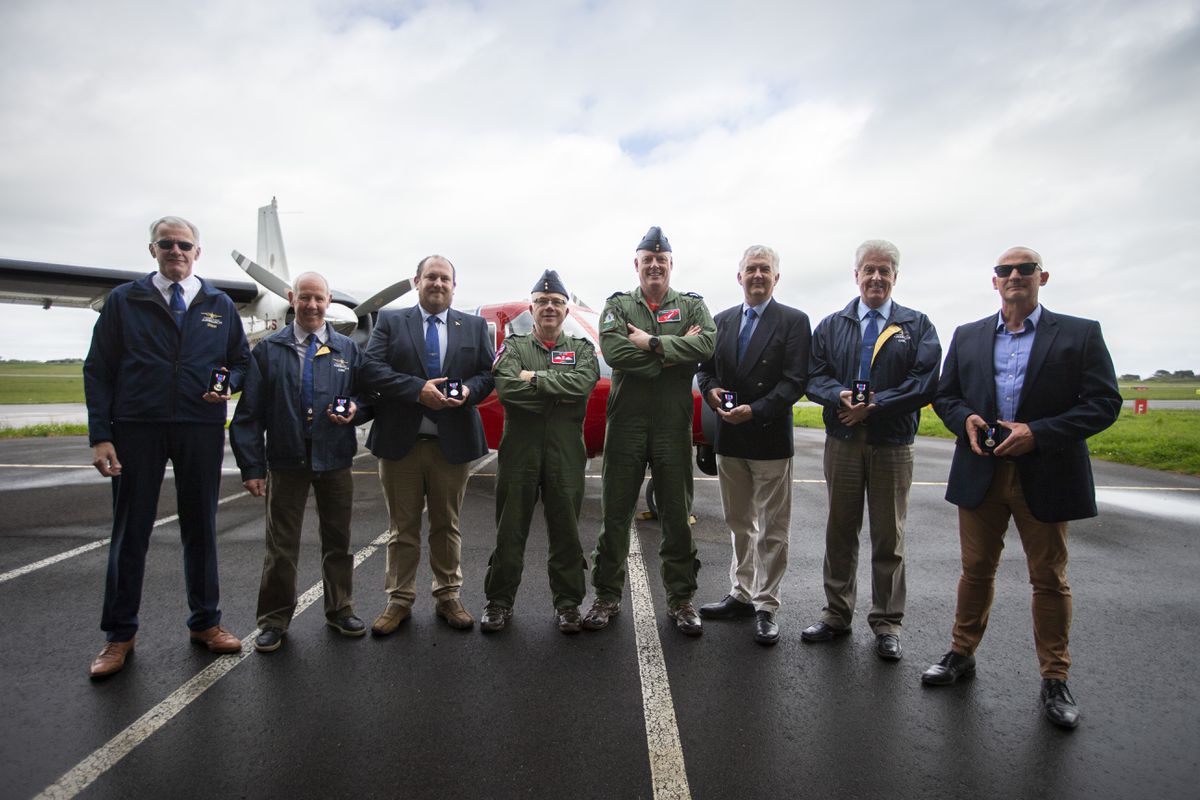RAF 201 Squadron Leader Stuart Roxburgh, fourth from left, with members of the Channel Islands Air Search who were presented with Queen’s Jubilee Medals. Left to right, Michael DeVon, Graham Gilbert, Gareth Le Page, Mark Utting, John Fitzgerald, Tim Robins and Troy Queripel. (Picture by Luke Le Prevost. 32088411)