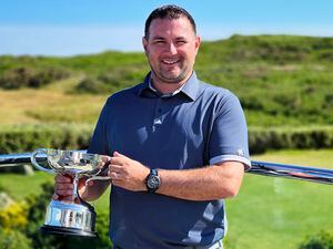 Jamie Blondel proudly holds the Bachmann Trophy having won the Men's Island Golf Championship for a second time..Picture by Tony Curr, 29-05-22. (30875696)