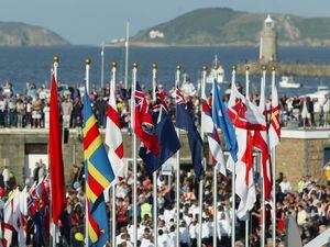 Guernsey's harbour scene in 2003 when the flags of the participating islands added colour to the opening proceedings: Let's keep the flags flying even if a full-on Games is not possible in 2021. (28676695)