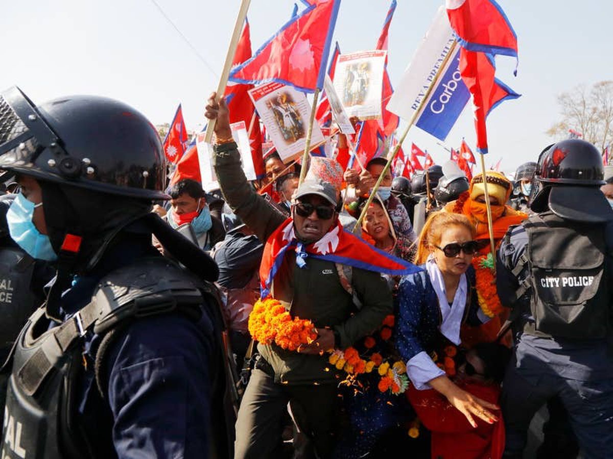 Riot police clash with protesters calling for return of Nepal’s