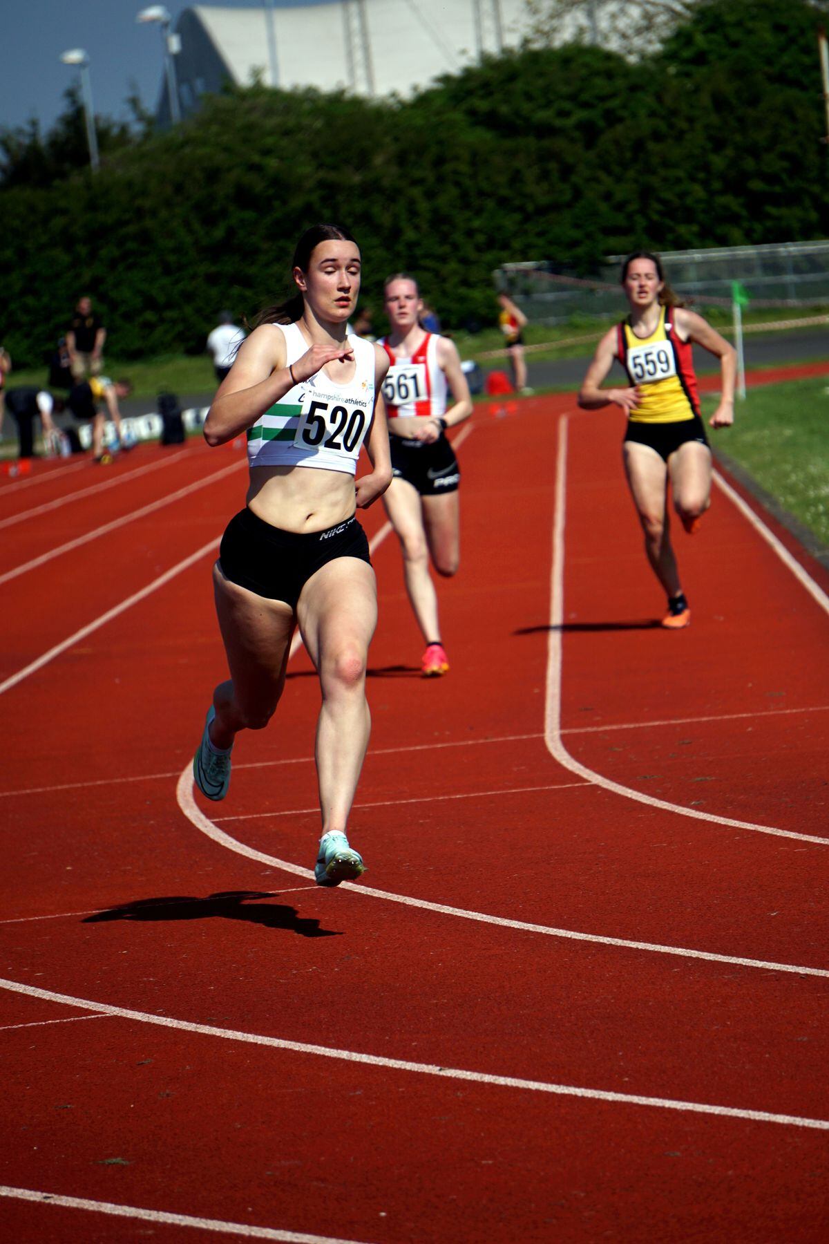 U17 county champion Isabelle Lowe tackles the first bend of the 300m. (Picture by Jamie Ingrouille, 32118602)