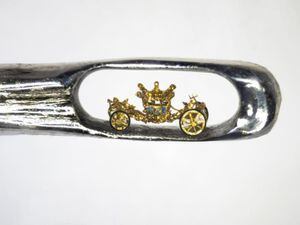 Sculptor creates tiny royal coach in the eye of a needle as Jubilee tribute