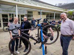 Terry Coule, right, looks on as adventure Cycles co-owner Dan Thwaite checks his bike over in the special clinic at the hospital. Also pictured are Alex Costen, left, active travel officer, for the Health improvement Commission, and Emma Wood, project support officer for the hospital modernisation team. (Picture By Luke Le Prevost, 32133802)