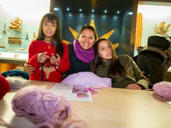Claudia Pozo and her daughters, Lara, 9, left, and Lucy, 12, having a go at hand-knitting. (Pictures by Luke Le Prevost, 31533981)