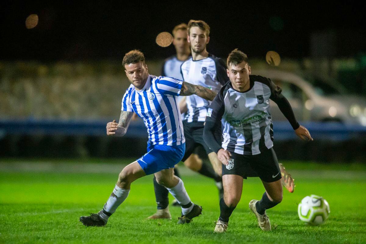 Back in the picture: Wayne Bishop (left) scored on his return to the Bels first team and gave Saints defenders, including Brad O'Regan (right) a testing evening. (Picture by Peter Frankland, 30335478)