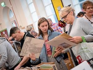 Hannah James searches the collections at the charity record and CD fair at Blanchelande College with her mother, Christine. (Picture by Andrew Le Poidevin)