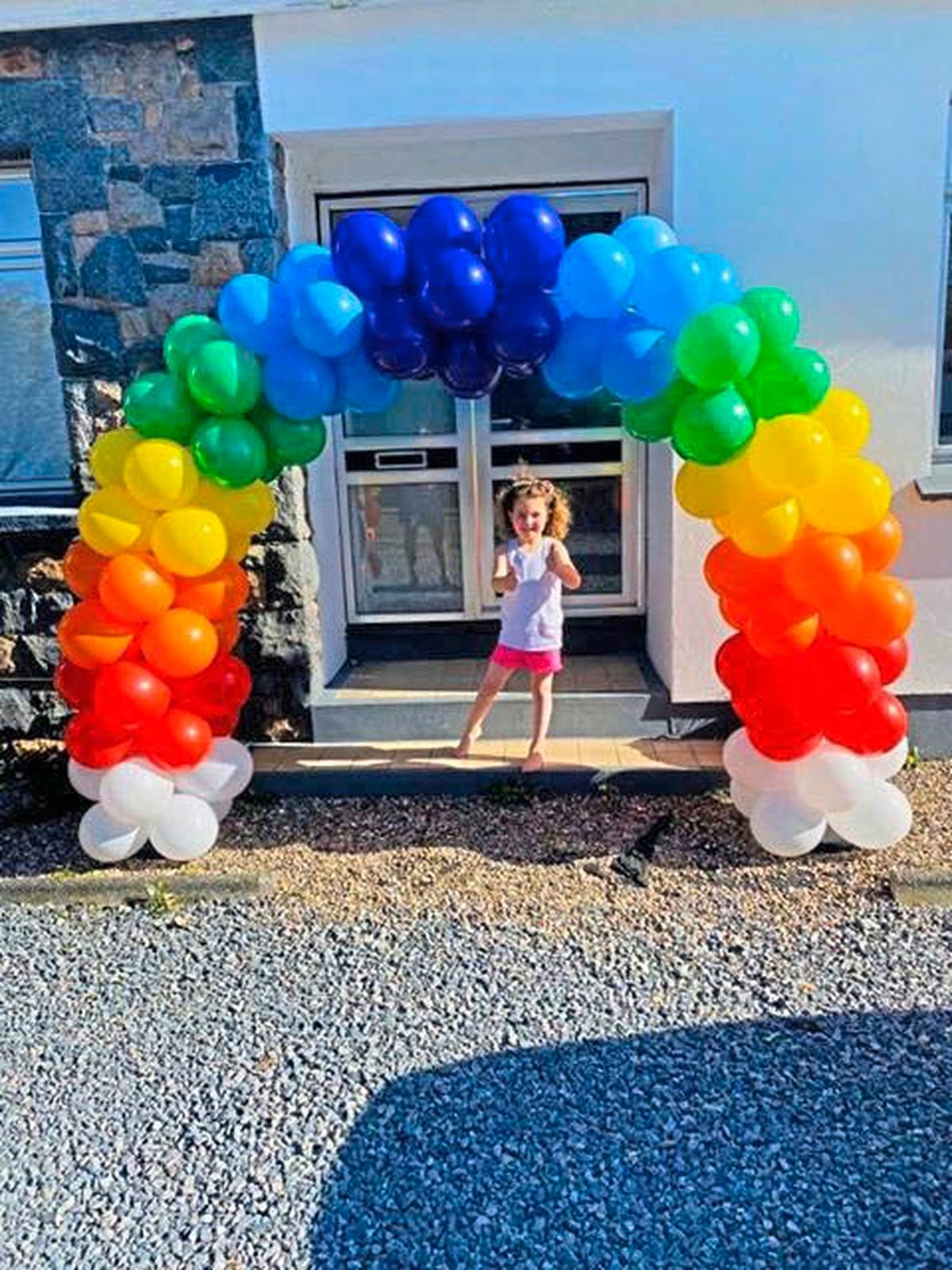 A rainbow balloon Arch at the Camp du Roi home of Briony-Rae Domaille, 4.