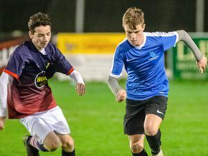 Alex Scott (right) in action for Les Beaucamps in the 2018 Spiller Cup final - the Elizabeth College player is Joe Adams, now also a professional himself at League One side Wigan Athletic. (Picture by Andrew Le Poidevin)