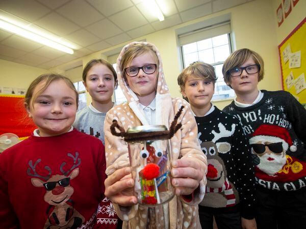 The group of, left to right, Evie Davis, 10, Ava Winterflood, 10, Freya De Carteret, 11, Joe Davies, 10, and Shay Murphy, 10, put their faith in a Christmas-themed jar of sweets. (Picture by Peter Frankland, 31495417)