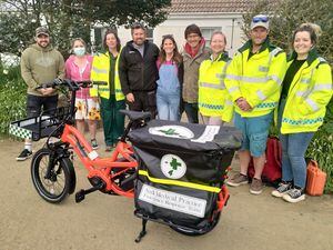Members of the Emergency Response Team pictured with their electric bike, the island’s doctor and the Sark Lawnmower Race organisers, who donated money towards its cost.
