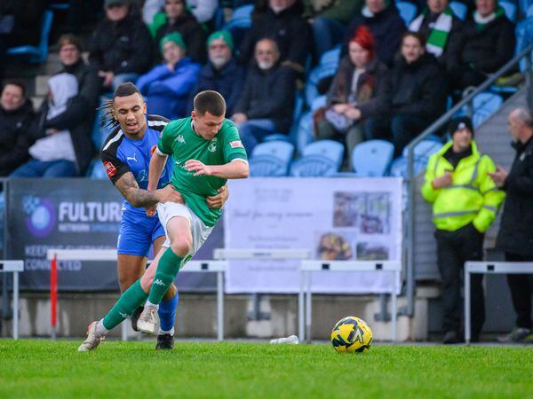 Guernsey FC substitute Keene Domaille is pulled back by Bedfont Sports captain Joseph Morrison, who was booked for this foul. (Pictures by Andrew Le Poidevin, 31513735)