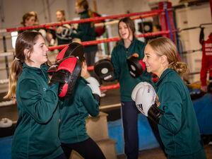 Picture by Sophie Rabey.  14-01-22.  Ladies College have taken on Boxing as a new sport as part of their Physical Education Lessons. Action from the Guernsey Amalgamated Boxing Club (St Martins).Lea Phillips (15) and Charlotte Griggs (15). (30387647)