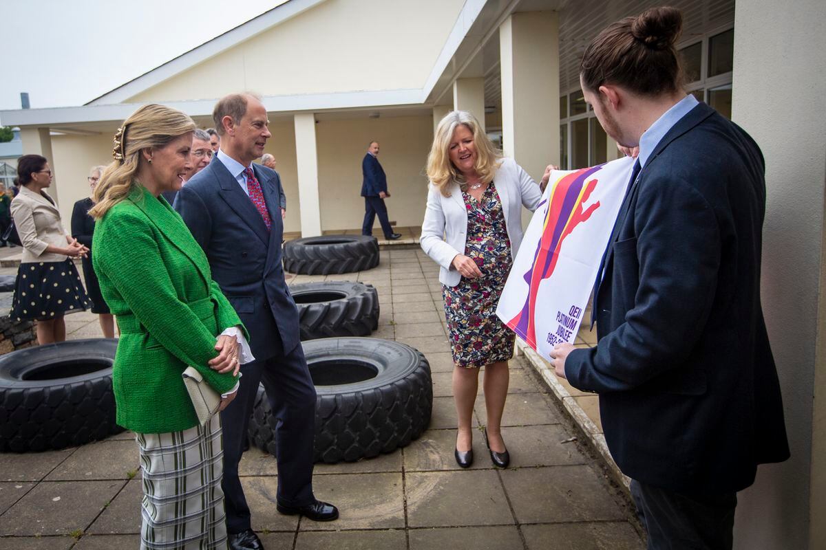 Picture By Peter Frankland. 10-05-22 Royal visit 2022. Earl and Countess of Wessex Prince Edward and Sophie Wessex visit Forest School. With L-R - Nikki Symons, head of marketing and events for sport and culture and Ben Le Marchant who designed the Jubilee flag. (30803225)