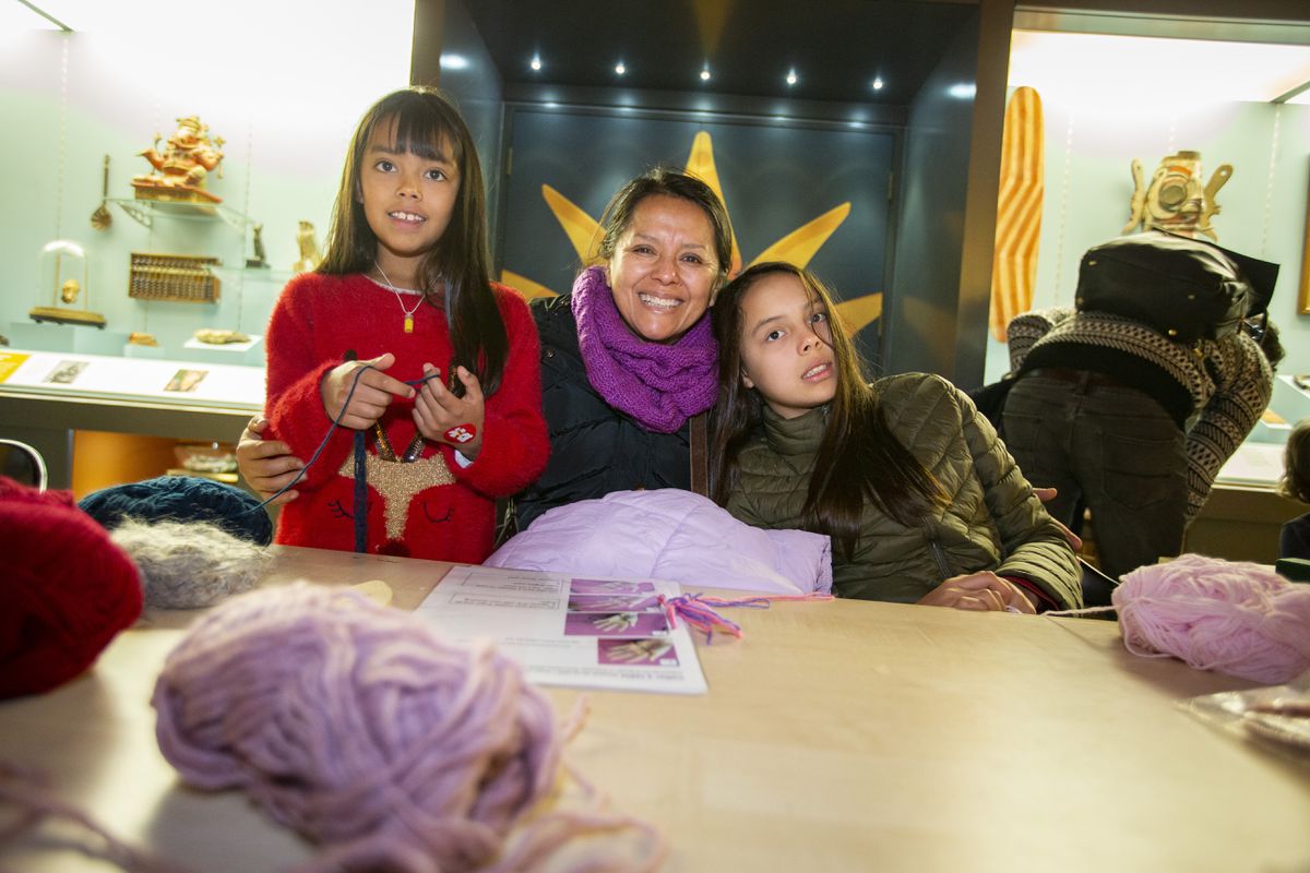 Claudia Pozo and her daughters, Lara, 9, left, and Lucy, 12, having a go at hand-knitting. (Pictures by Luke Le Prevost, 31533981)
