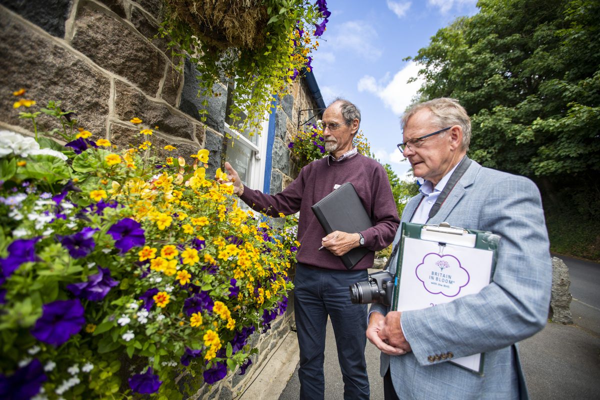Judges Dave Stuart from Floral Guernsey and national judge Rae Beckwith, from Britain in Bloom with the Royal Horticultural Society, visiting St Andrew’s Douzaine room to judge the floral decoration outside the building. (Picture by Luke Le Prevost, 30996919)